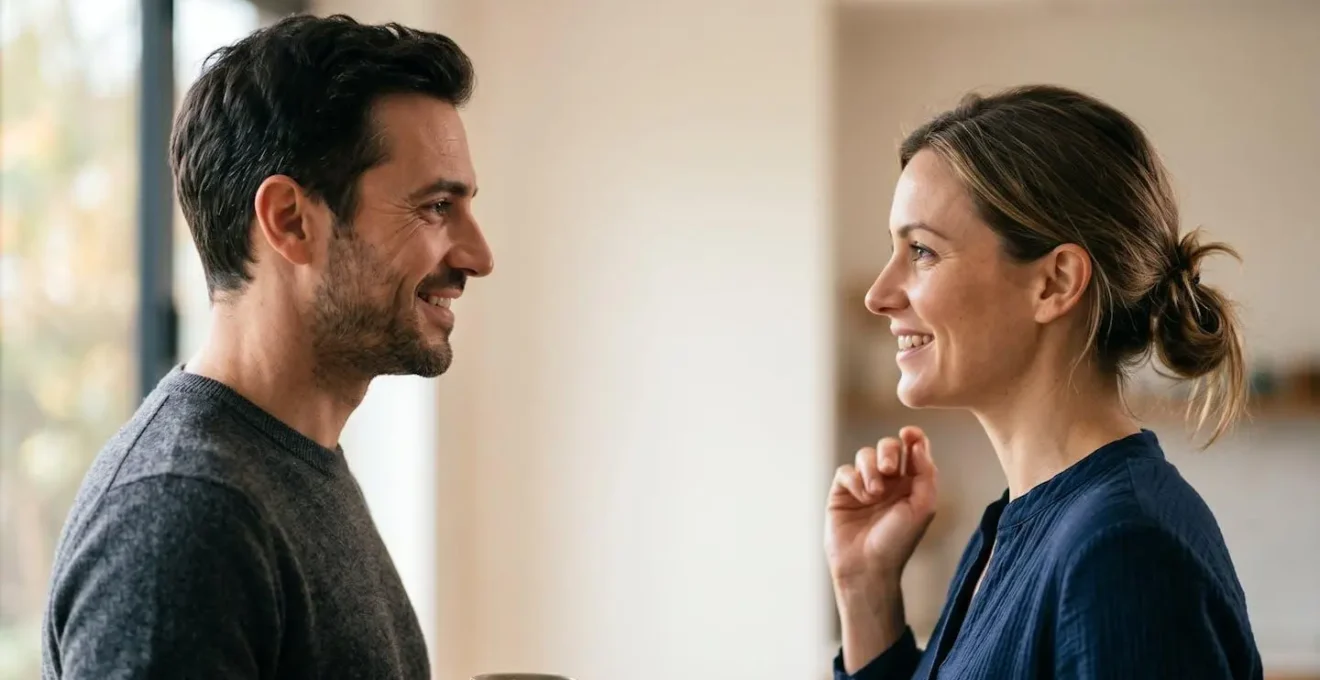 Two people in genuine face-to-face conversation showing authentic emotional connection and neural synchronization