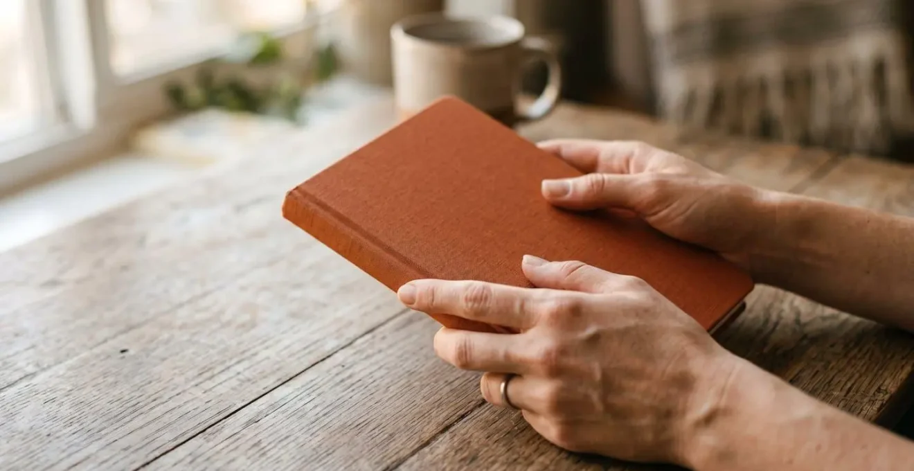 Close-up of hands writing notes in preparation for a difficult conversation, symbolizing emotional preparation and scripting
