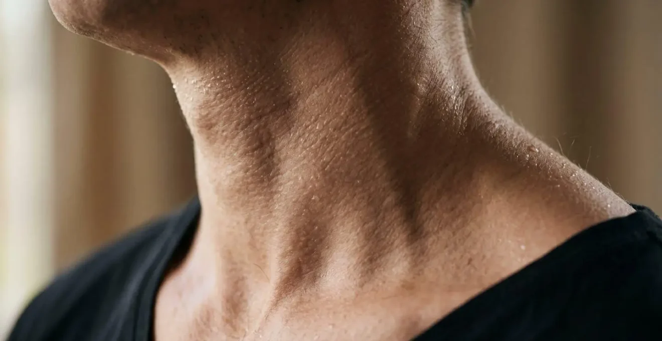 Close-up photograph showing physiological stress response through perspiration and tension, representing chronic cortisol elevation during isolation