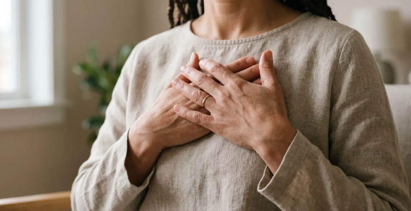 Close-up of hands resting gently on chest during a breathing exercise, conveying self-regulation and calm